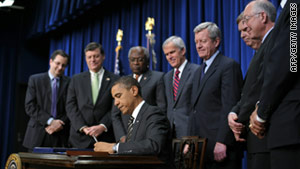 President Obama signs an act funding settlements with minority farmers and Native Americans on Wednesday.