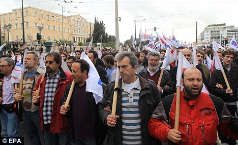 Protest: Strikers carrying placards demonstrate outside the Greek Parliament in Athens. Greece is among a number of EU countries struggling financially