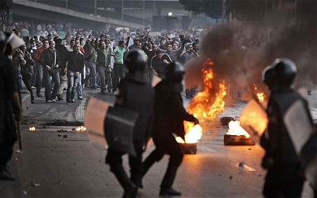 Egyptian riot police clash with anti-government activists in Cairo, Egypt