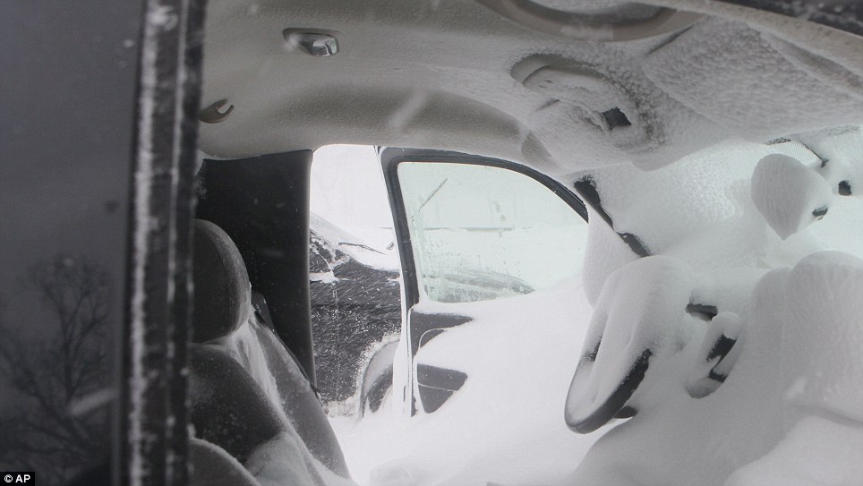 The inside of a pickup truck that was stranded and left open on Lake Shore Drive on Wednesday shows the full ferocity of the blast as the white stuff almost covers the steering wheel