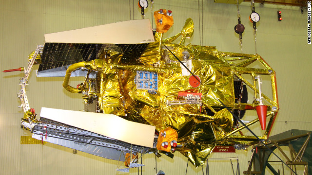 Russian Federal Space Agency specialists work on the Phobos-Grunt spacecraft in October.