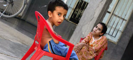 Four-year-old Yousif Hamed and his sister, Inas, both of whom suffer from birth defects, at their home in Fallujah, 11/12/09. (photo: Muhannad Fala'ah/Getty Images)