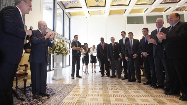 A Congressional delegation singing happy birthday to president Shimon Peres. (photo credit: Miriam Alster/Flash90) A Congressional delegation singing happy birthday to president Shimon Peres. (photo credit: Miriam Alster/Flash90)