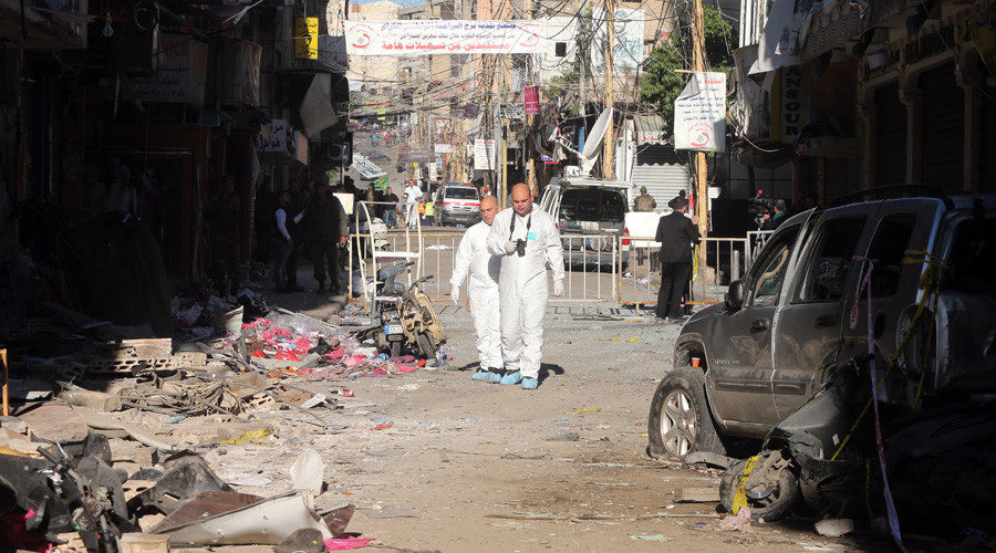 Lebanese forensic police investigate the site of a twin bombing attack that rocked a busy shopping street in the area of Burj al-Barajneh, a Beirut stronghold of Lebanon's Shiite movement Hezbollah, the day after the attack on November 13, 2015.  AFP