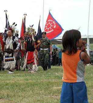 A child watches a Color Guard Veteran's Pow Wow at the Pine Ridge Indian Reservation