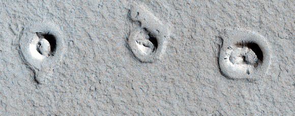 These unusual shapes on Mars surface are actually cones and inflated lava flows, Credit: NASA/JPL/University of Arizona.