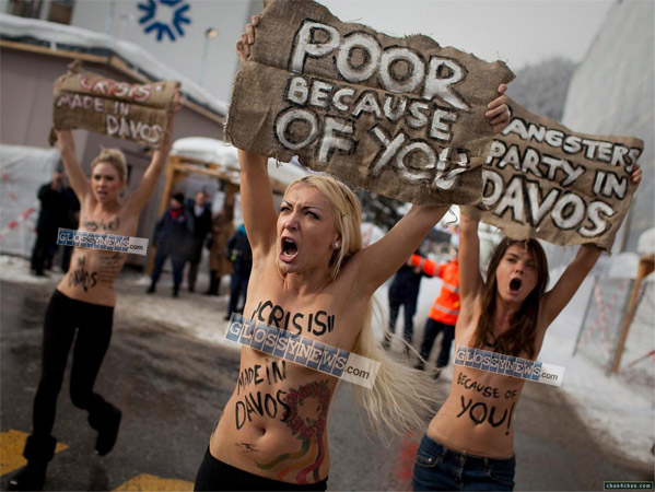 "THE MARCH OF THE SLUTS". The bare-breasted Ukranian Femen group associated with the Pussy Riot girls. These decadent "artistes" like to make their point through sexual exhibitionism and religious blasphemy—political tactics widely promoted and popularized by our Jew-controlled Western media.