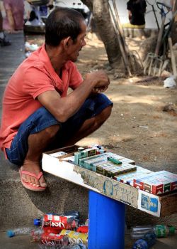 Philippine cigarettes are among the cheapest in the world, costing less than one U.S. dollar for a pack of 20. They are available right outside schools, in parks, in streets and other public places, and sold by vendors in single sticks for about two pesos. Credit: Kara Santos/IPS