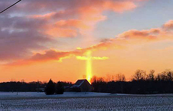 Mechaele Loraff of Buchanan, Michigan, snapped this photo of a sunrise Jan. 13, appearing to look like a cross. (courtesy Mechaele Loraff/Facebook)