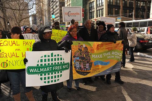 walmart-workers-communities Community members rally against Walmart in New York City (asterix611 / Flickr)