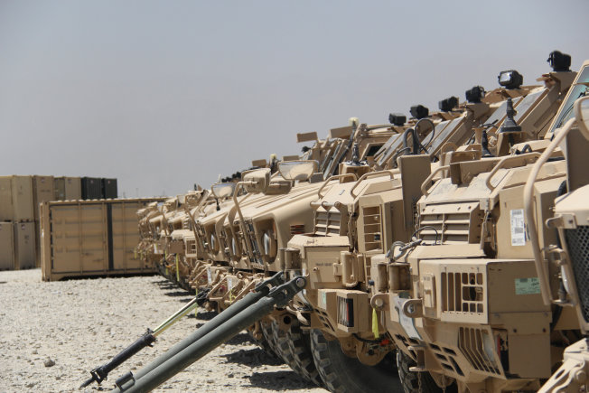 U.S. military vehicles seen in a row.