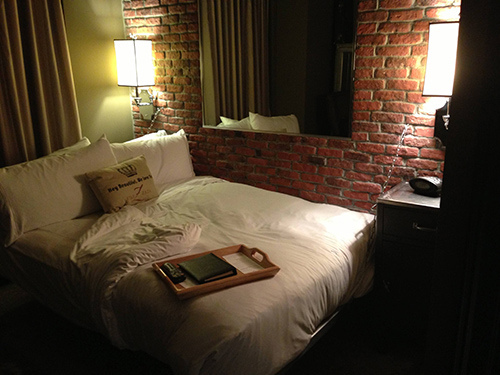 The room is about a third of the size of other rooms in the hotel. The mirror is embedded in the brick wall, leading some Redditors to think that it is actually a two-way mirror...